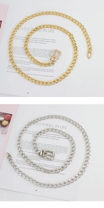 Detail of trendy hollow link chain belts in gold and silver finish with rectangular buckle