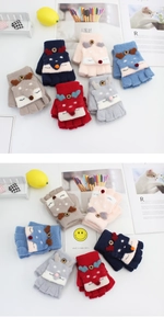 Detailed view of dual-use knit gloves showing flip-top design and cartoon fox pattern
