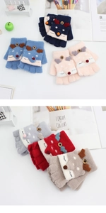 Detail of colorful cartoon fox knit mittens showing the convertible flip cover and soft material