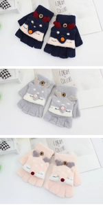Detailed view of children's knit gloves with cute fox flap in navy, grey, and pink colors