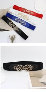 Détail de la ceinture élastique pour femme avec boucle feuille dorée et texture