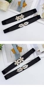 Detail of elastic waist belt with sparkling floral and leaf rhinestone buckle closures