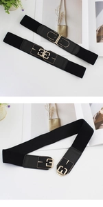 Detail of two black elastic waist belts with gold geometric buckles and PU leather accents