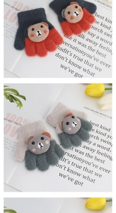 Detail of warm knitted baby mittens with cute 3D cartoon bear decor and ribbed cuffs