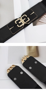 Detail showing gold 3E metal buckle and black lycra leather texture on elastic belt