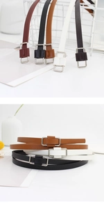 Detail of slim faux leather belts with metallic rectangular buckles in five colors