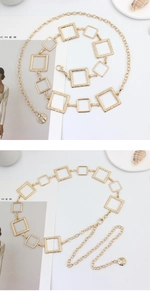 Detail of gold metal waist chain with square links, textured finish and lobster clasp