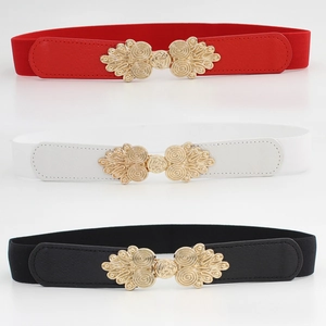Women's vintage elastic waist belts in red, white, and black with retro gold buckle