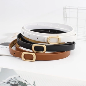 Three minimalist women's slim leather belts in black, white, and brown with gold buckles