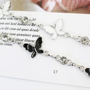 Bowtie metal waist chain for women with silver butterfly pendant and sparkling rhinestones