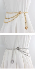 Detail view of multi-layer metal waist chain with embossed sun flower charms on dress