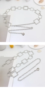Detail view of silver metal waist chain featuring square hollow links and polished finish