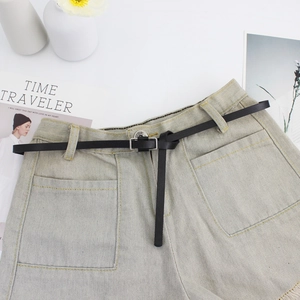 Light blue denim high-waisted shorts with black slim leather belt and frayed hem