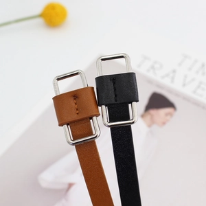 Slim minimalist leather belts with silver buckles for women, in brown and black colors