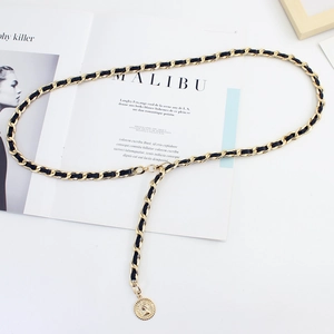 Elegant gold metal chain belt with black leather weave and round coin pendant accessory