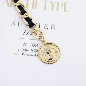 Golden woven chain waist belt with black leather strap and vintage coin pendant charm
