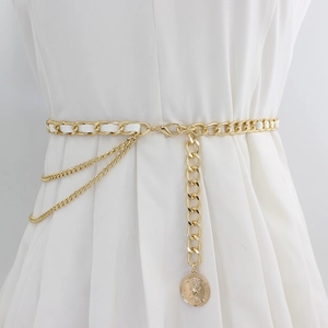 Gold metal chain belt with woven white leather and coin pendant on white dress