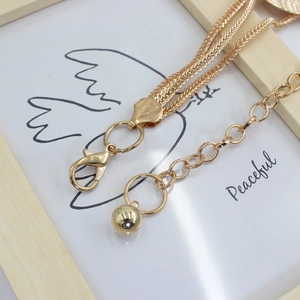 Golden round metal link waist chain belt with lobster clasp and ball pendant for dresses