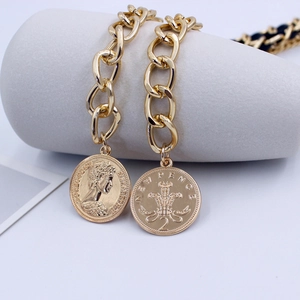 Golden metal chain belt with coin pendants featuring Queen Elizabeth and Prince of Wales