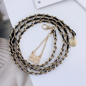 Elegant gold metal chain belt with black leather weave and round tag for women dresses