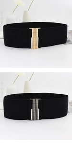 Detail view of wide elastic belts for women featuring gold and silver buckle options