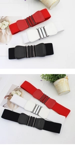 Detailed macro view of elastic wide belts with vintage double oval metal buckles in three colors
