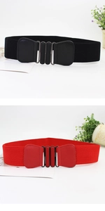 Close-up of black and red elastic wide waist belts with interlocking oval metal buckles