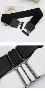 Detail of interlocking metal buckles on wide elastic belts in black and white colors