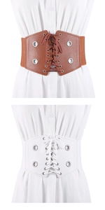 Détail de la ceinture à lacets vintage avec œillets métalliques en cuir marron et blanc
