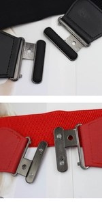 Detail view of double oval metal buckle on elastic waist belt with engraved code WD4392
