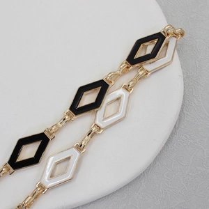 Elegant gold chain belt with black and white diamond charms for dresses and sweaters