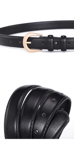 Détail d'une fine ceinture en cuir noir avec une boucle fer à cheval dorée élégante