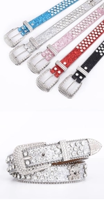 Macro detail of rhinestone belts with skull studs and shiny western buckles in five colors