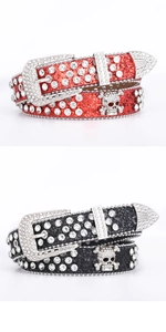 Close-up of red and black rhinestone belts with crystal skull metal hardware and buckles