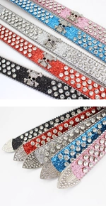 Macro shot of Y2K rhinestone skull studs and sparkling sequin texture on waist belts