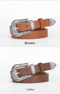 Vue détaillée de ceintures vintage marron et café avec boucles gravées en argent