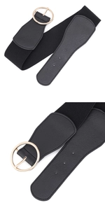 Detail of black wide elastic belt with gold round buckle and lychee leather texture