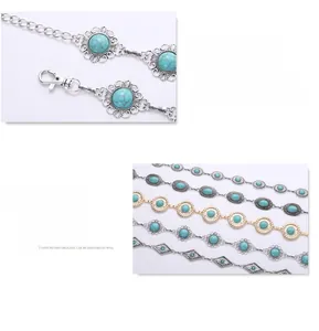 Detail view of vintage silver and gold waist chains with lobster clasp and turquoise stones
