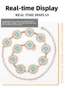 Detailed view of vintage gold metal waist chain with embossed rings and green turquoise