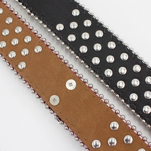 Punk style studded leather belts in black and brown with silver metal rivets and bead edges