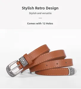 Detail of vintage brown thin belt with 12 pre-punched holes and engraved metal buckle