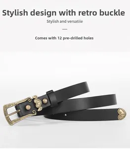 Detail of vintage carved buckle black belt with 12 pre-drilled holes and metal bows
