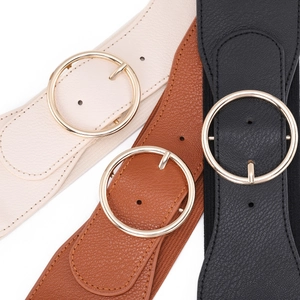 Elastic wide belt with oversized round gold buckle in black, brown, and cream white