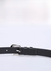 Detailed view of black leather belt with silver metal double ring buckle and fine stitching