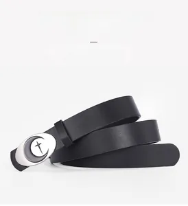 Detail of black leather belt featuring an oval moon buckle and 12 adjustable holes