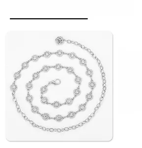 Detail of silver metal waist chain with rhinestone flowers and a rose pendant