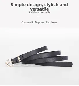 Detail of slim black waist belt with gold pin buckle and 10 adjustable eyelet holes