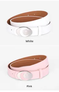 Detail view of pink and white PU leather belts with silver crescent moon oval buckles