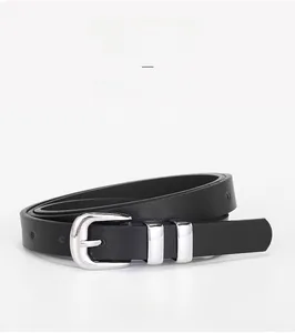 Close-up of black leather thin belt featuring double silver metal rings and buckle details