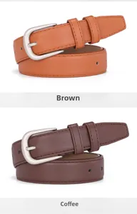 Detail view of brown and coffee leather belts with matte silver buckles on white background